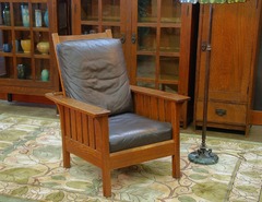 L J G Stickley vintage Morris chair with slats to the seat.